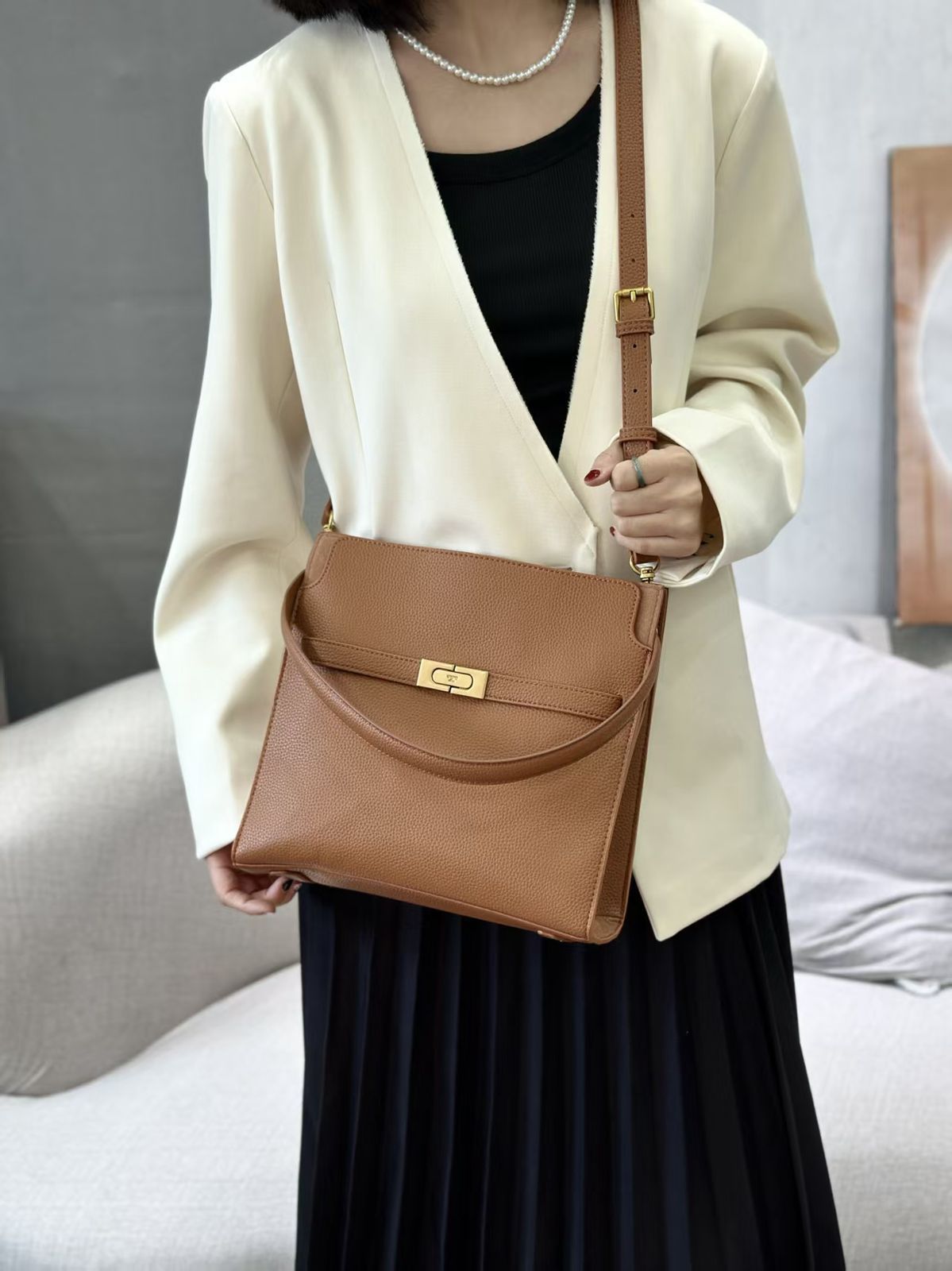 Tory Burch women's shoulder bag with flap design and adjustable strap