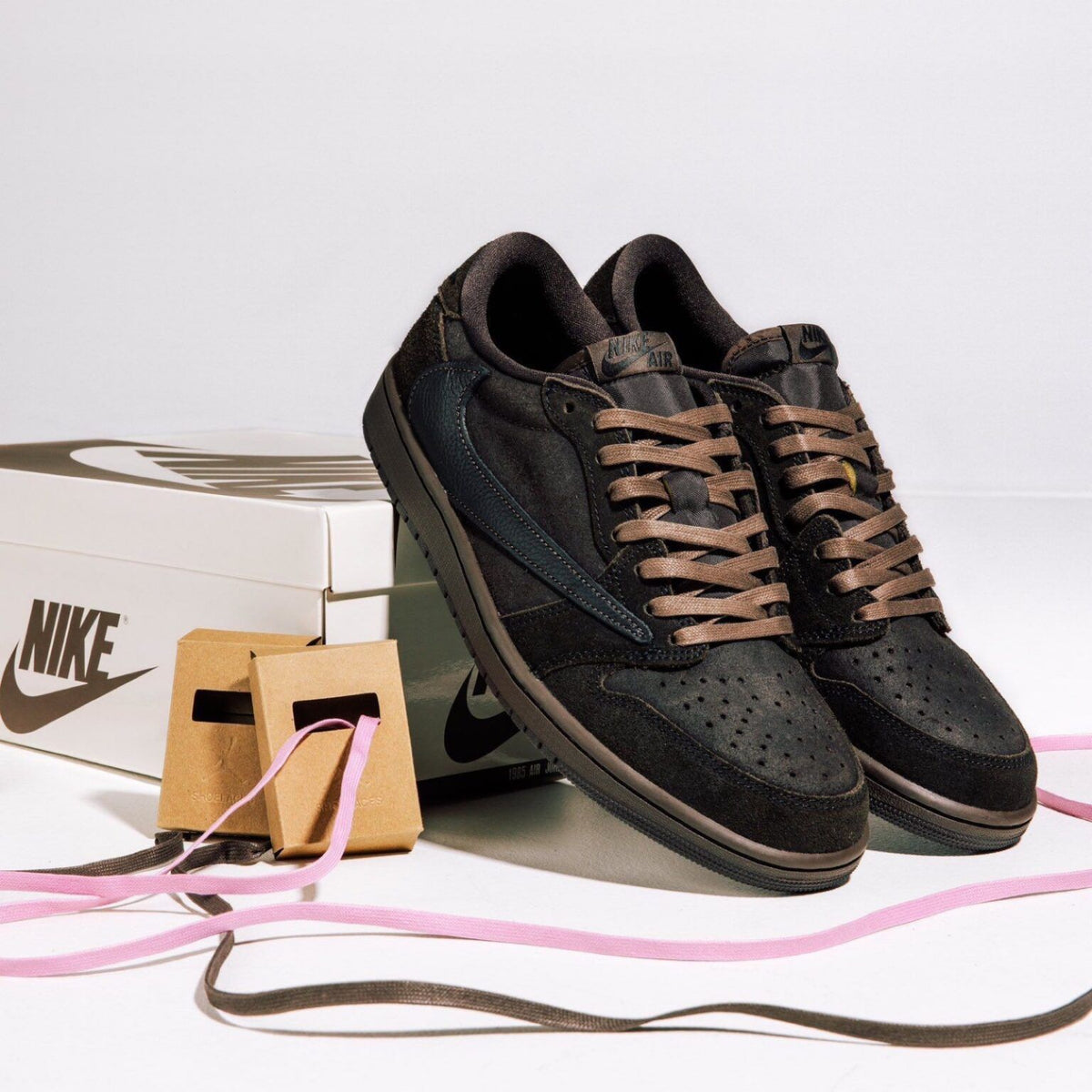 Travis Scott Jordan 1 Low displayed with contrasting laces