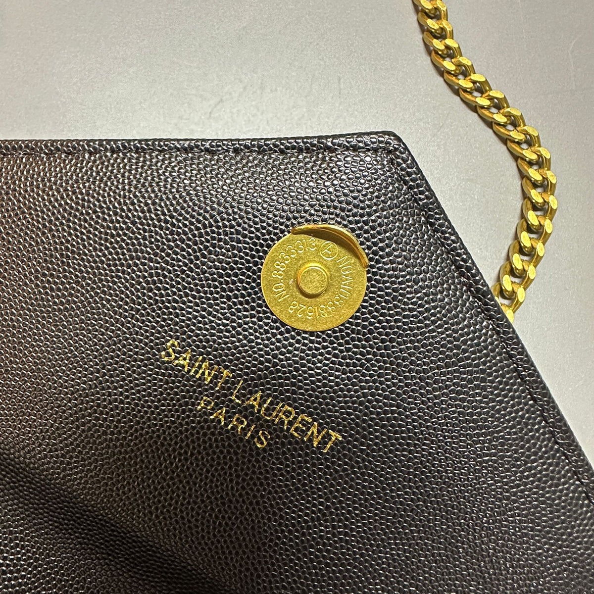 YSL style handbag front logo and gold hardware detail