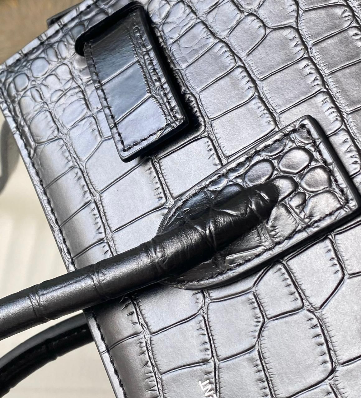 Close up view of crocodile texture YSL style women's bag