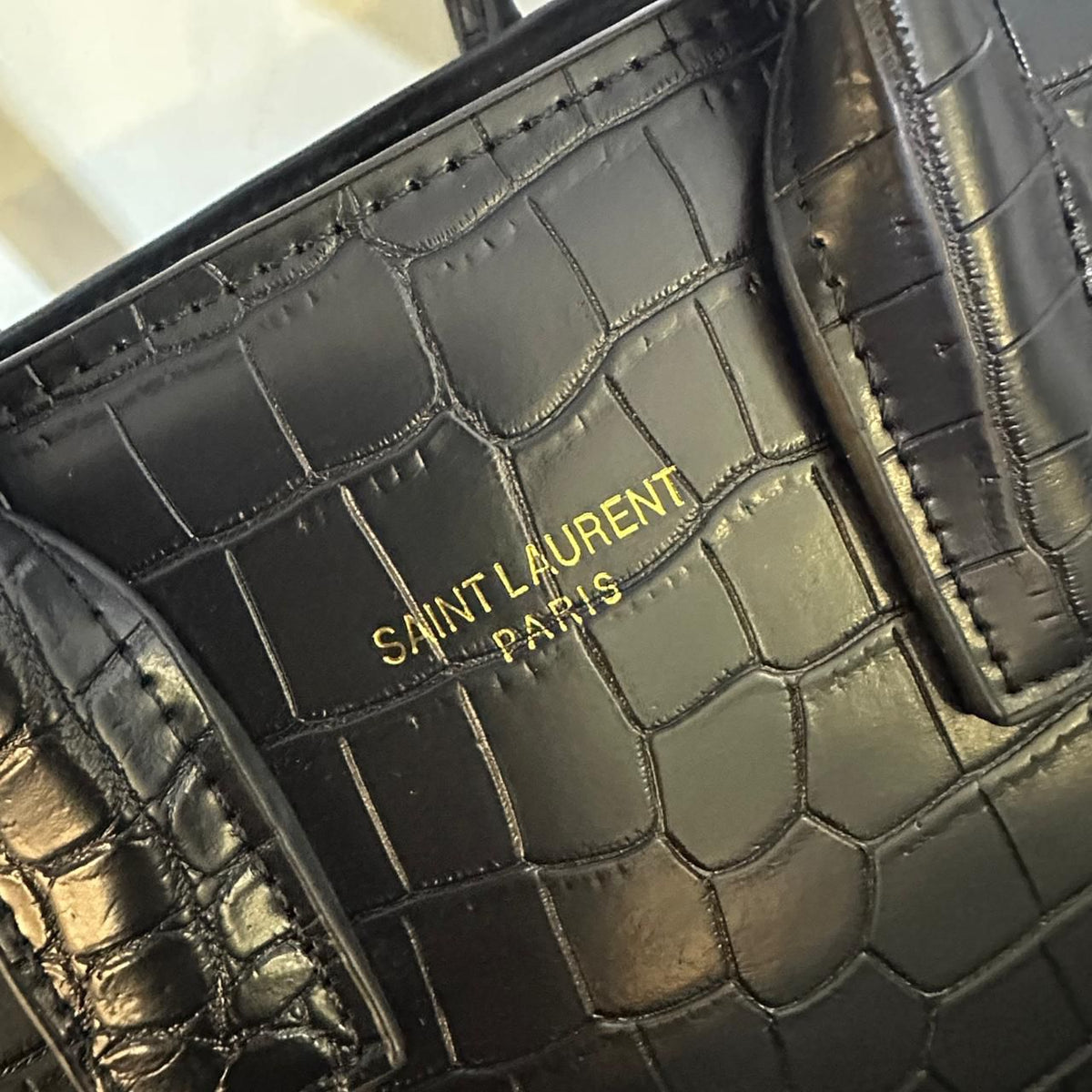 YSL style handbag gold logo and premium texture detail